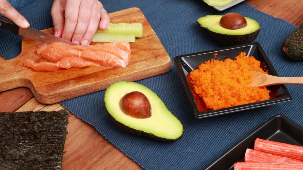 Making sushi with avocado and salmon