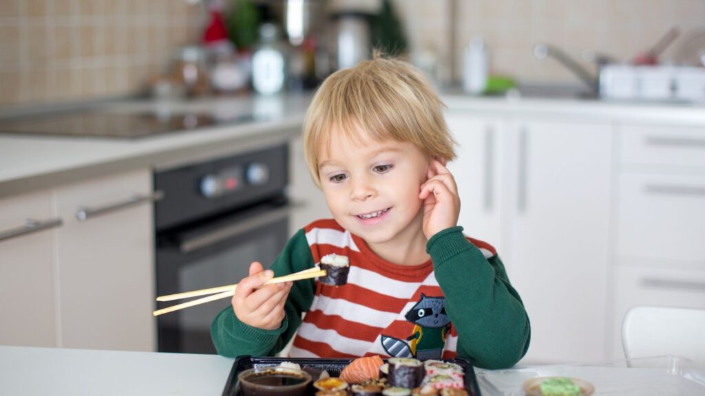 kid eating sushi