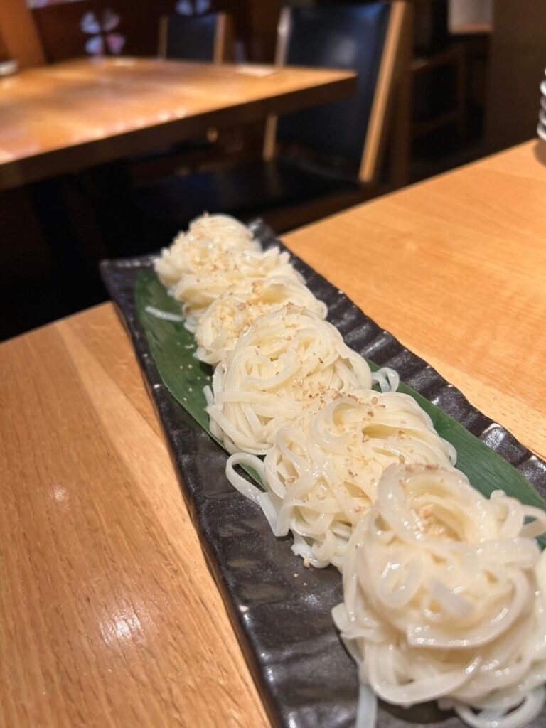 Stand-up sushi restaurant Natura Inaniwa udon with sesame miso sauce